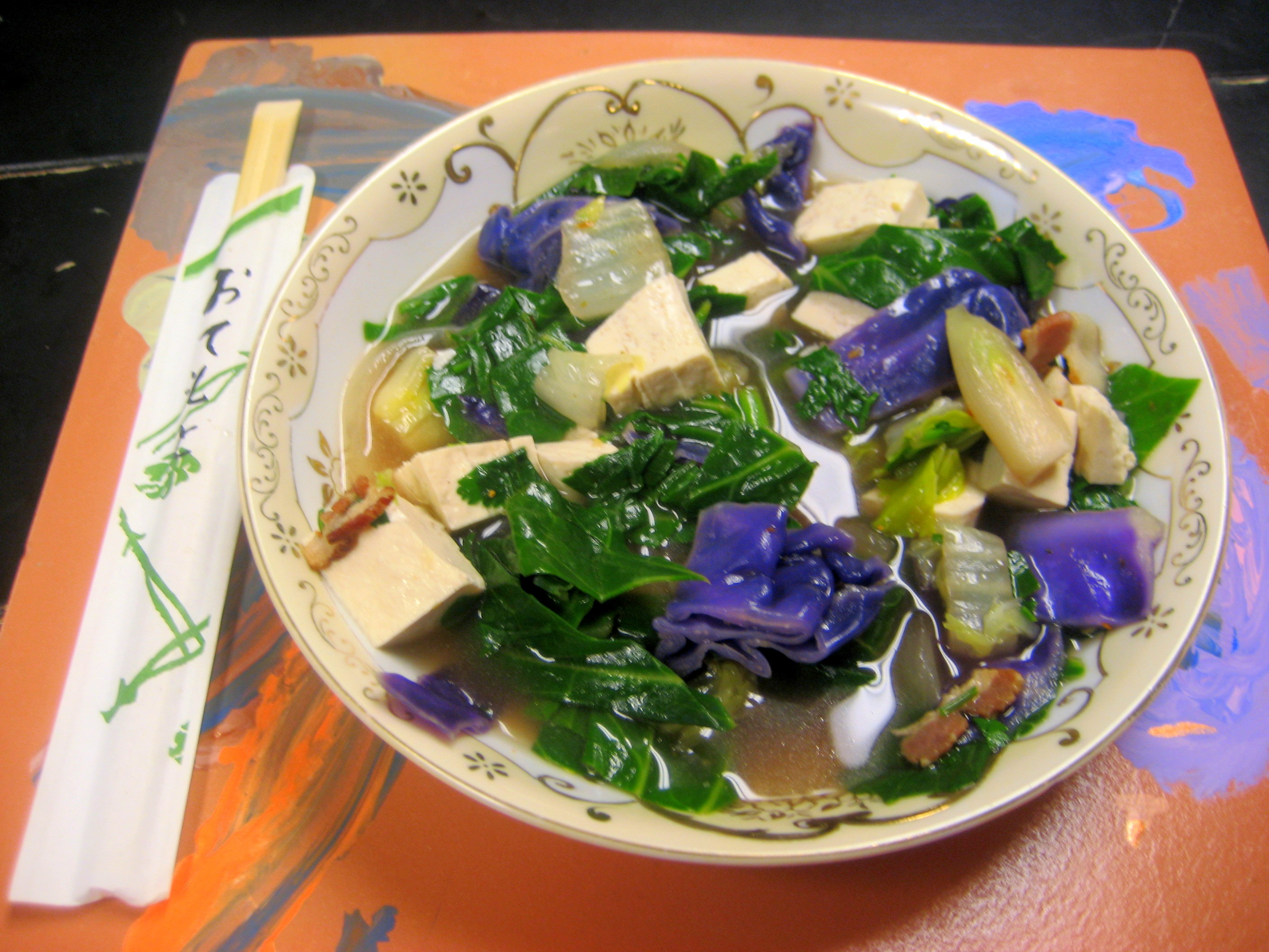 three greens and tofu in a spicy ginger broth