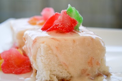 angel food cake with pink grapefruit cream cheese icing