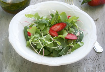 Spinach and radish sprout salad with strawberries and spinach in a mint vinaigrette