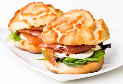 dutch crunch bread sandwich with prosciutto, tomatoes and mozzarella