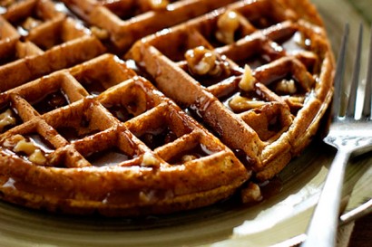 pumpkin spice waffles with praline pecan syrup