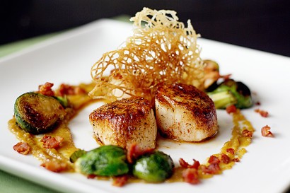 Seared sea scallops with golden raisin puree and bacon braised brussels sprouts