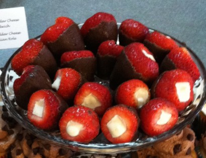 dark chocolate-covered, cheesecake-stuffed strawberries