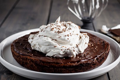 flourless brownie with dark chocolate glaze & coconut whipped cream
