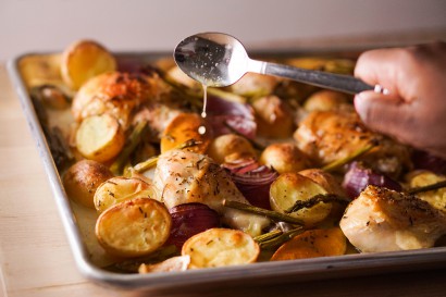 Roasted lemon rosemary chicken with potatoes onions and asparagus