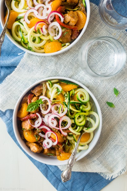 Healthy chicken stir-fry with dijon orange almond sauce and zucchini noodles