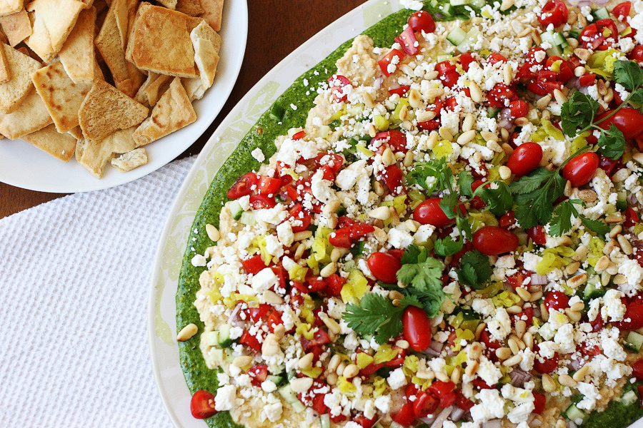 Tasty Kitchen Blog Cilantro Pecan-Pesto Layered Mediterranean Dip. Guest post by Natalie Perry of Perry's Plate, recipe submitted by TK member Beth (campgrandma) of Grandma B's Kitchen.