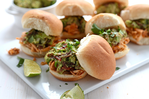 Tasty Kitchen Blog: Spicy Pulled Chicken Sliders with Bacon Queso Guacamole. Guest post by Megan Keno of Wanna Be a Country Cleaver, recipe submitted by TK member Serena of Domesticate Me.